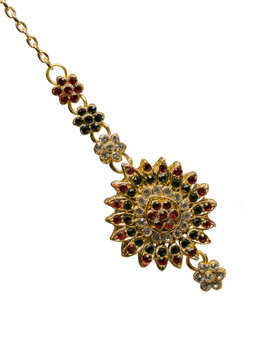 indian jewelry on the forehead on a white isolated background