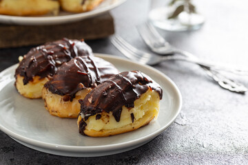 Traditional french eclairs with chocolate.