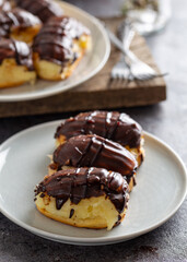 Traditional french eclairs with chocolate.
