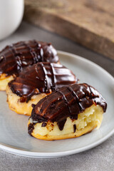 Traditional french eclairs with chocolate.