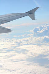 Obraz premium fluffy clouds in the sky shot from plane