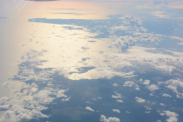fluffy clouds in the sky shot from plane