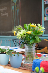 Vase of flowers on teachers desk in Waldorf classroom