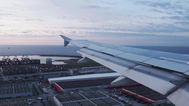 Timelapse footage of aeroplane wing as plane is about to land moving forwards and backwards