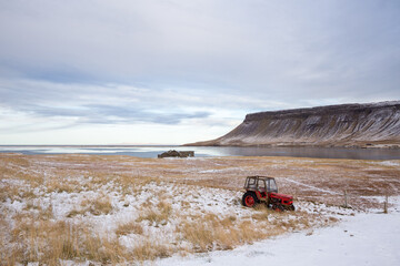 Red tractor in fjord of Snæfellsnes peninsula, Iceland
