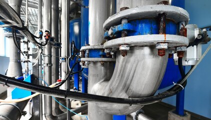 Large industrial water treatment and boiler room. Close-up of valves with servo