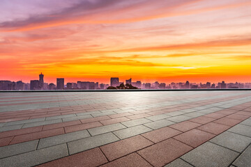 Fototapeta na wymiar Empty square floor and city skyline with buildings in Hangzhou at sunrise.