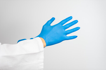 a doctor wearing blue latex gloves