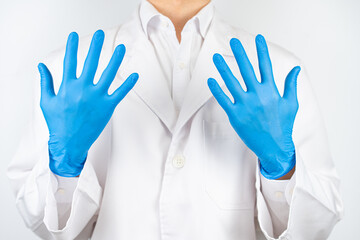 a doctor wearing blue latex gloves