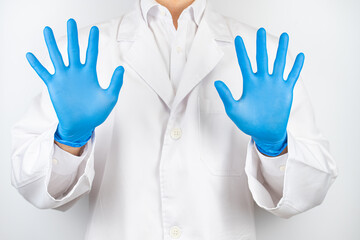 a doctor wearing blue latex gloves