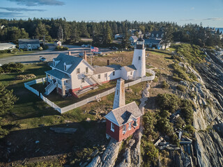 Aerial drone image of the Pemaquid lighthouse and point on the Maine Coast at sunrise