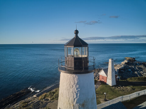 Aerial drone image of the Pemaquid lighthouse and point on the Maine Coast at sunrise