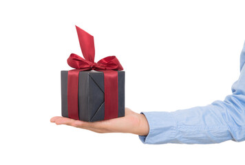Holding a gift in one hand in front of white background