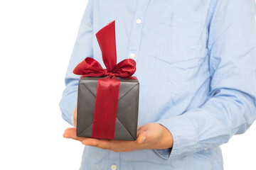 A man in a blue shirt gives you a gift