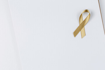 gold ribbon on open notebook