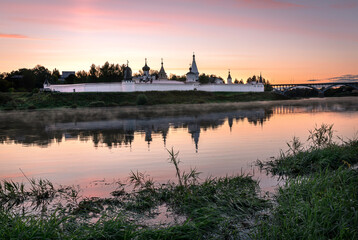 Dawn on the river with a view of the monastery