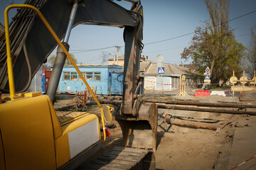 repair of a pipe, an excavator on the road 