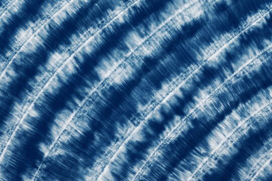 Indigo Blue Shibori Tie dye fabric texture pattern. White and Blue colors.