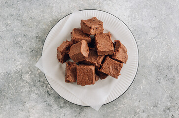 Raw vegan chocolate fudge. Healthy vegan food concept.