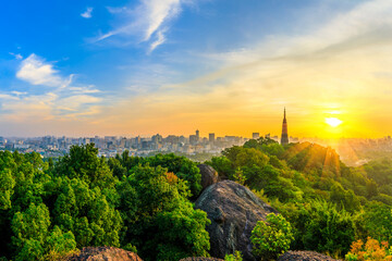 Fototapeta premium Ancient Baochu Pagoda.Chinese traditional architecture and modern city skyline in Hangzhou at sunrise,China.