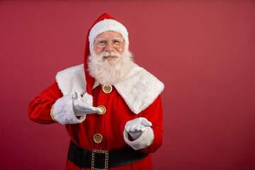 Santa Claus on red background with copy space. Presenting.