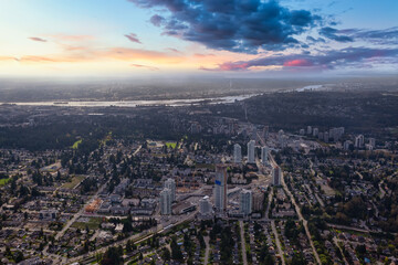Obraz premium Aerial view of a modern cityscape and commercial buildings. Twilight Colorful Sunrise. Taken in Burnaby, Greater Vancouver City, British Columbia, Canada.