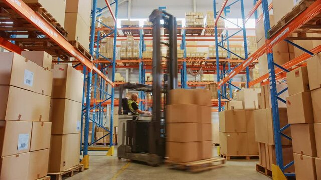 Time-Lapse In Warehouse Forklift Driving with Pallets Moving Cardboard Boxes with Products from Shelves. Logistics, Distribution Center with Products Ready for Global Shipment, Customer Delivery