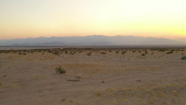 Sunset in the desert of the salt lake of mexicali baja california mexico, place used for some migrants to try cossing the border tu US,