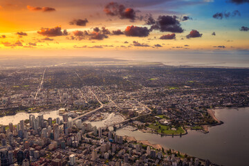 Aerial View of Downtown Vancouver City, British Columbia, Canada. Colorful Sunrise Artistic Render. Modern Cityscape from above.