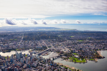 Aerial View of Downtown Vancouver City. Taken during a bright sunny morning in British Columbia, Canada. Modern Cityscape from above.