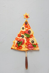 Piece of pizza set like christmas tree.