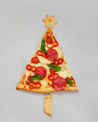 Piece of pizza set like christmas tree.