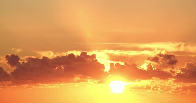 Timelapse of sensational golden hour red sunset with cumulus clouds, static