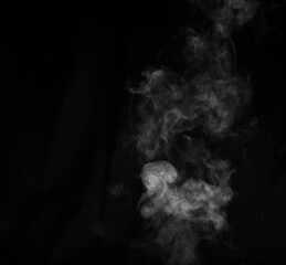 Figured smoke on a dark background. Abstract background, design element, for overlay on pictures