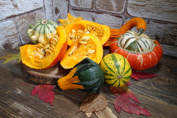 Colorful pumpkins. Decorative pumpkin and  autumn leaves - decoration 