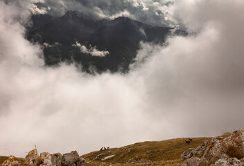 Clouds in the mountains of Ingushetia, Russia. View from the top of the mount Stolovaya (Myat-Loam)
