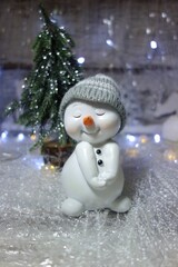 Funny  snowman 
 in the winter scenery Christmas winter scence.Christmas background.