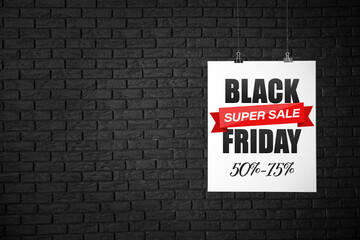 Obraz premium Poster with text BLACK SUPER SALE FRIDAY on dark brick background