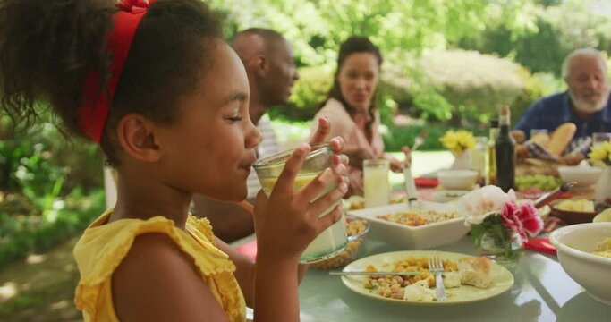 African American girl spending time in garden,