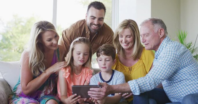 Portrait of six members of a multi-generation Caucasian family spending time at home together