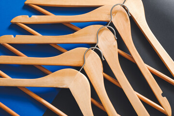 Clothes hangers on dark background