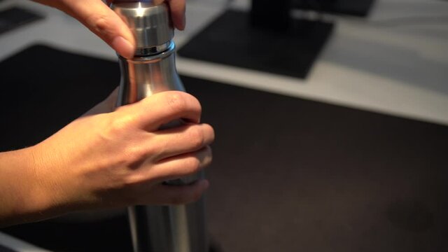 opening a steaming termos bottle. (4k)