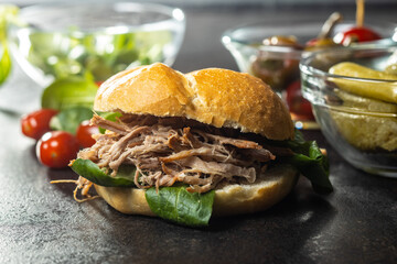 Sandwich with pulled meat.