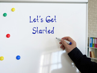 Business concept meaning Let's Get Started with inscription on the sheet.
