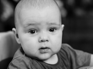 black and white close portrait of baby boy