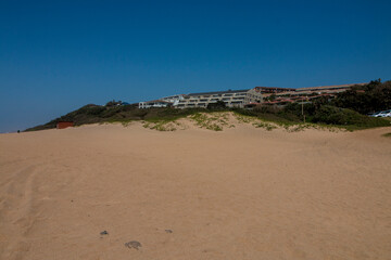 Wide Stretch of Beach Sand Before Residential Apartments