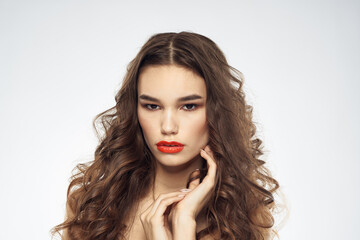 Fototapeta premium Elegant woman with bare shoulders red lips glamor attractive look cropped look