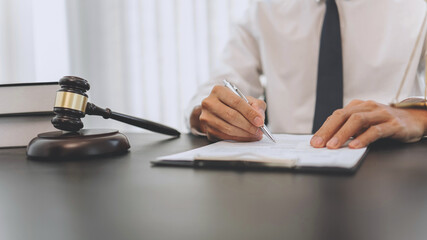 Counselor with legal documents discussing with client about legacy case.