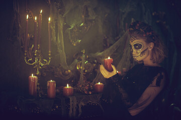 Skeleton Catrina with candles