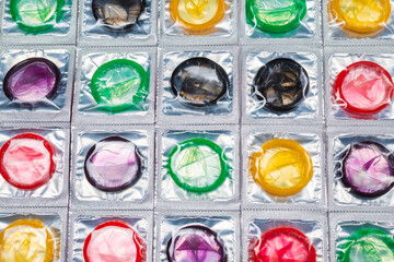 Colorful condoms background.